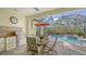 Outdoor kitchen, pool, and spa with ample seating at 21 Bayhead Ln, Osprey, FL 34229