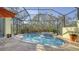 Inviting screened pool and spa with flagstone patio at 21 Bayhead Ln, Osprey, FL 34229