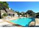 Inviting community pool with adjacent patio and cabana at 21 Bayhead Ln, Osprey, FL 34229