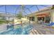 Enjoy this screened pool and spa with a flagstone patio and outdoor seating at 21 Bayhead Ln, Osprey, FL 34229
