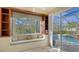 Built-in window seat with shelves and pool view at 21 Bayhead Ln, Osprey, FL 34229