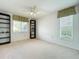 Bedroom featuring neutral carpet, ceiling fan, and natural light from windows, perfect for relaxation at 4382 Madeira Ct # 3361, Sarasota, FL 34233