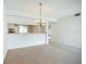 Cozy dining area featuring a decorative chandelier, open to kitchen and living space for easy entertaining at 4382 Madeira Ct # 3361, Sarasota, FL 34233
