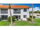 Condo exterior with lush landscaping, well-manicured lawn, and visible lanai at 4382 Madeira Ct # 3361, Sarasota, FL 34233