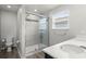 Clean bathroom with double sinks and a shower at 5018 Brickwood Rise Dr, Wimauma, FL 33598