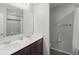 Bathroom with double vanity and a tub shower combo at 5018 Brickwood Rise Dr, Wimauma, FL 33598