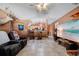 Relaxing living room with a large TV and comfortable seating at 14308 Tugwell Ave, Port Charlotte, FL 33953