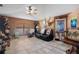 Spacious living room featuring a tile floor, comfortable seating, and a ceiling fan at 14308 Tugwell Ave, Port Charlotte, FL 33953