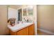Bathroom with a single sink and built-in storage at 14308 Tugwell Ave, Port Charlotte, FL 33953
