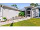 Landscaped walkway leading to the front entrance at 14308 Tugwell Ave, Port Charlotte, FL 33953
