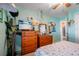 Bedroom with dresser, TV, and nautical theme at 14308 Tugwell Ave, Port Charlotte, FL 33953