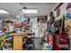 Well-equipped workshop in garage, featuring various tools and storage at 14308 Tugwell Ave, Port Charlotte, FL 33953