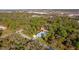 Aerial view showcasing the property and its lush surroundings at 14308 Tugwell Ave, Port Charlotte, FL 33953
