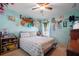 Bedroom with a queen-size bed and nautical-themed decor at 14308 Tugwell Ave, Port Charlotte, FL 33953