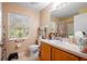 Bathroom with a toilet, single sink, and shower at 14308 Tugwell Ave, Port Charlotte, FL 33953