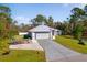 Single-story home with attached garage and boat at 14308 Tugwell Ave, Port Charlotte, FL 33953