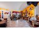 Spacious living room featuring unique decor and a tile floor at 14308 Tugwell Ave, Port Charlotte, FL 33953