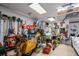 Garage workshop with motorcycle, workbench, and various tools at 14308 Tugwell Ave, Port Charlotte, FL 33953