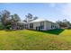 Single-story home with metal roof and large backyard at 14308 Tugwell Ave, Port Charlotte, FL 33953