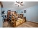 Large bedroom with a rustic log bed frame and laminate wood flooring at 14308 Tugwell Ave, Port Charlotte, FL 33953