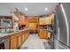 Well-equipped kitchen with wood cabinets and stainless steel appliances at 14308 Tugwell Ave, Port Charlotte, FL 33953