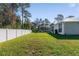 Large backyard with screened enclosure and grassy area at 14308 Tugwell Ave, Port Charlotte, FL 33953