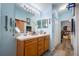 Double vanity bathroom with a view into another room at 14308 Tugwell Ave, Port Charlotte, FL 33953