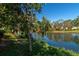 Peaceful view of a canal with lush greenery and mature trees at 3703 75Th E Dr, Sarasota, FL 34243