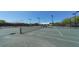 Well-lit tennis court ready for a match at 1713 Starling Dr # 1713, Sarasota, FL 34231