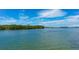 Scenic waterway view with boat and lush mangrove landscape at 1713 Starling Dr # 1713, Sarasota, FL 34231