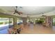 Relaxing community room with bookshelves, tables, and chairs, perfect for socializing at 1713 Starling Dr # 1713, Sarasota, FL 34231