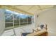 Relaxing screened porch with patio furniture and view of nature at 1713 Starling Dr # 1713, Sarasota, FL 34231
