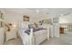 Bright bedroom with a white queen-size bed, and built-in dresser at 1713 Starling Dr # 1713, Sarasota, FL 34231