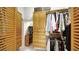 Large walk-in closet with ample shelving, drawers, and hanging space for clothes at 1713 Starling Dr # 1713, Sarasota, FL 34231