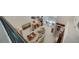 High-ceiling living room with comfortable seating, large windows, and access to a balcony at 1713 Starling Dr # 1713, Sarasota, FL 34231