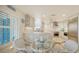 Open concept kitchen with breakfast nook and stainless steel appliances at 1713 Starling Dr # 1713, Sarasota, FL 34231