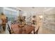 Bright dining room with a large wood table and access to the kitchen at 1713 Starling Dr # 1713, Sarasota, FL 34231