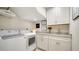Convenient laundry room with front-load washer and dryer at 1713 Starling Dr # 1713, Sarasota, FL 34231