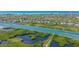 Aerial view showcasing waterfront property with boat access and lush landscape at 1713 Starling Dr # 1713, Sarasota, FL 34231