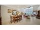 Formal dining room with wood table and chairs, adjacent to living area at 1713 Starling Dr # 1713, Sarasota, FL 34231