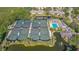 Aerial view of community tennis courts and pool at 1713 Starling Dr # 1713, Sarasota, FL 34231