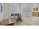 Home office with a standing desk and two monitors at 1713 Starling Dr # 1713, Sarasota, FL 34231