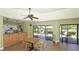 Well-equipped community kitchen with wood cabinets and access to a patio at 1713 Starling Dr # 1713, Sarasota, FL 34231