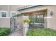 Inviting entryway with wrought iron gate and brick walkway at 1713 Starling Dr # 1713, Sarasota, FL 34231
