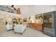 Open living room with high ceilings, comfy seating, and a wine cooler at 1713 Starling Dr # 1713, Sarasota, FL 34231