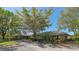 Exterior view of the community clubhouse, showcasing its architecture and landscaping at 1713 Starling Dr # 1713, Sarasota, FL 34231