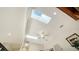 High ceiling detail with skylights and ceiling fan at 1713 Starling Dr # 1713, Sarasota, FL 34231