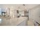Bright kitchen with expansive island and stainless steel appliances at 1713 Starling Dr # 1713, Sarasota, FL 34231