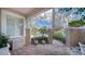 Brick patio with wrought iron gate and lush landscaping at 1713 Starling Dr # 1713, Sarasota, FL 34231