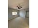 Upstairs bedroom with carpet, ceiling fan, and window at 5600 Bentgrass Dr # 103, Sarasota, FL 34235